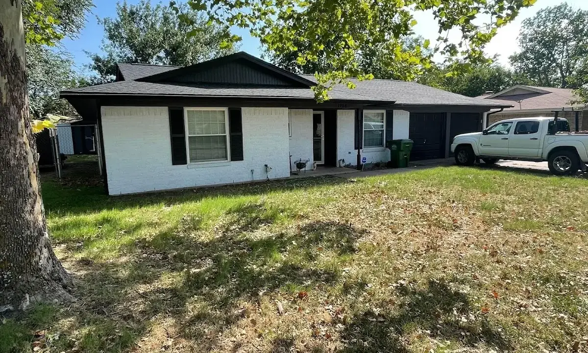 Professional roofing crew working on a residential roof in West Haven